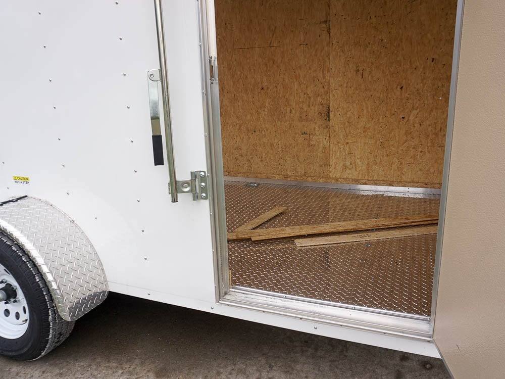 6' X 12' White Enclosed V-Nose Trailer with Diamond Plate Floor Storage image 20